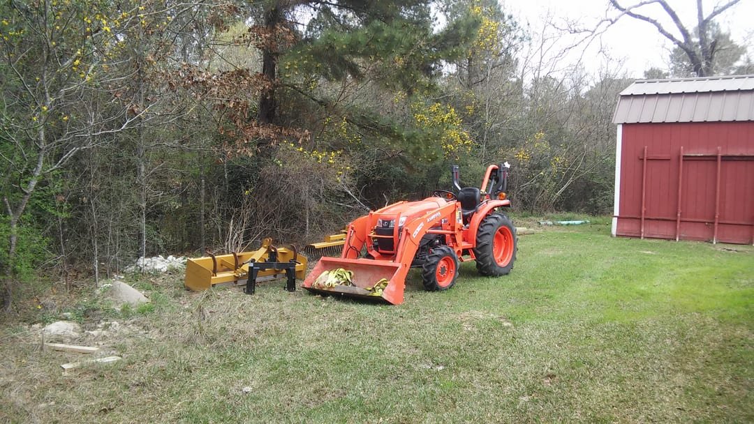 Company tractor on a fence job site