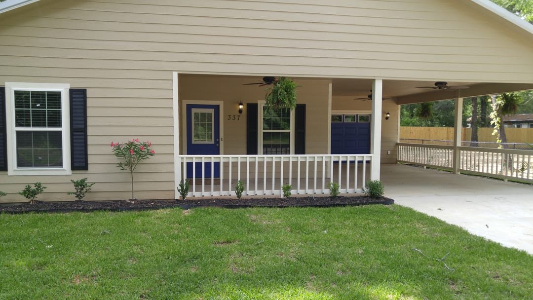 Finished property with fence lines and outbuildings
