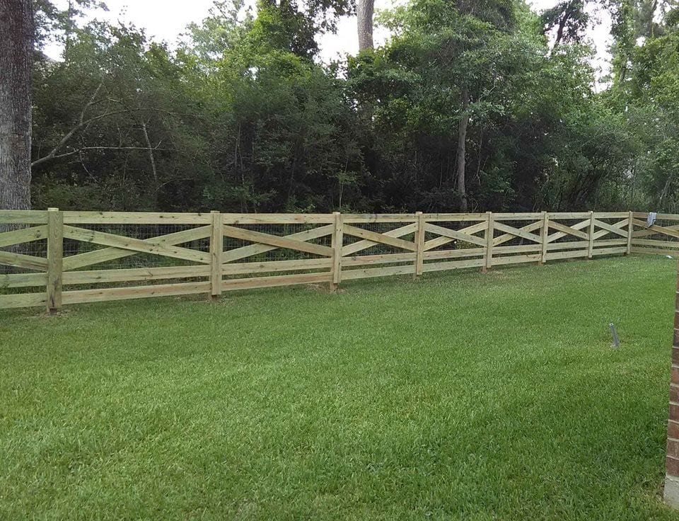Cross buck wood fence around a horse property