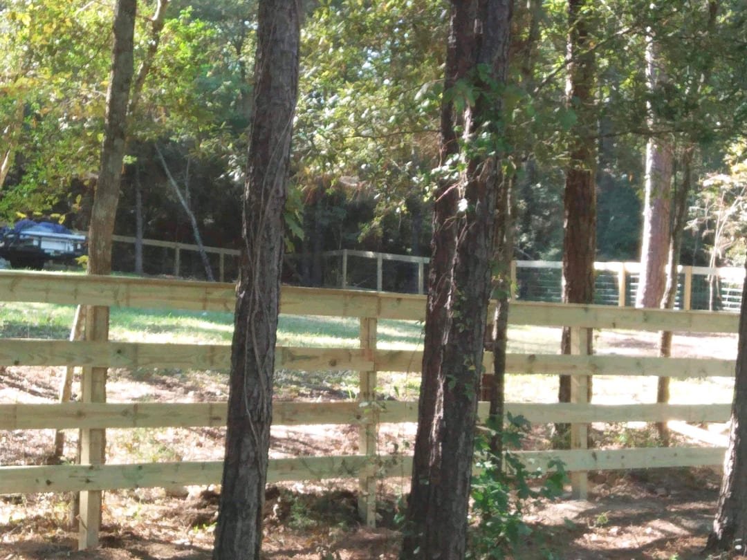 Wood rail fence around a pasture