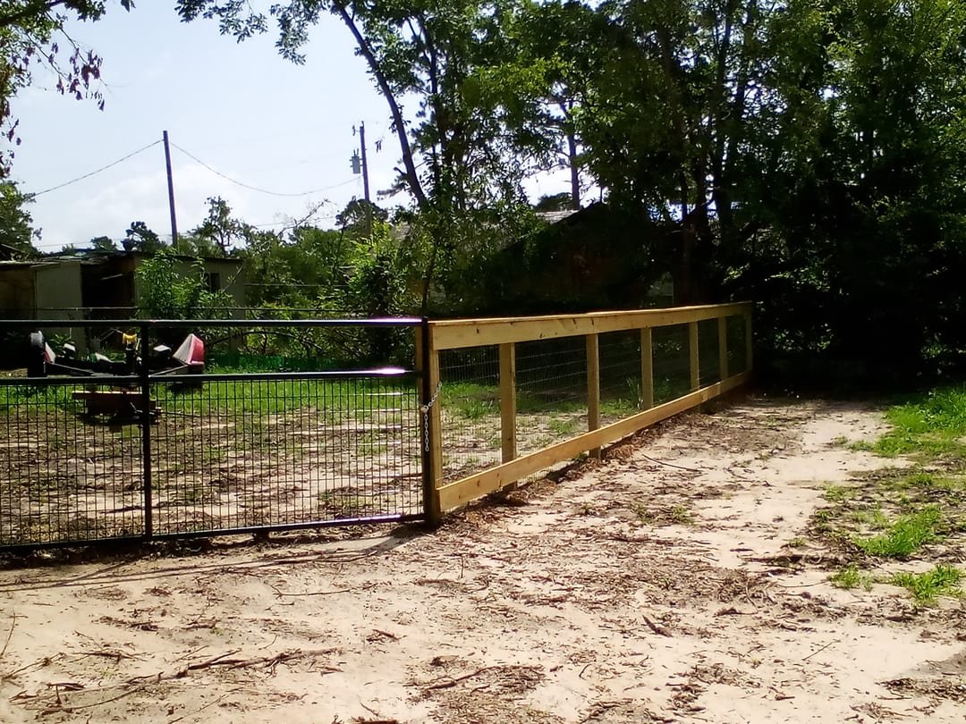 Tube gate across a rural driveway