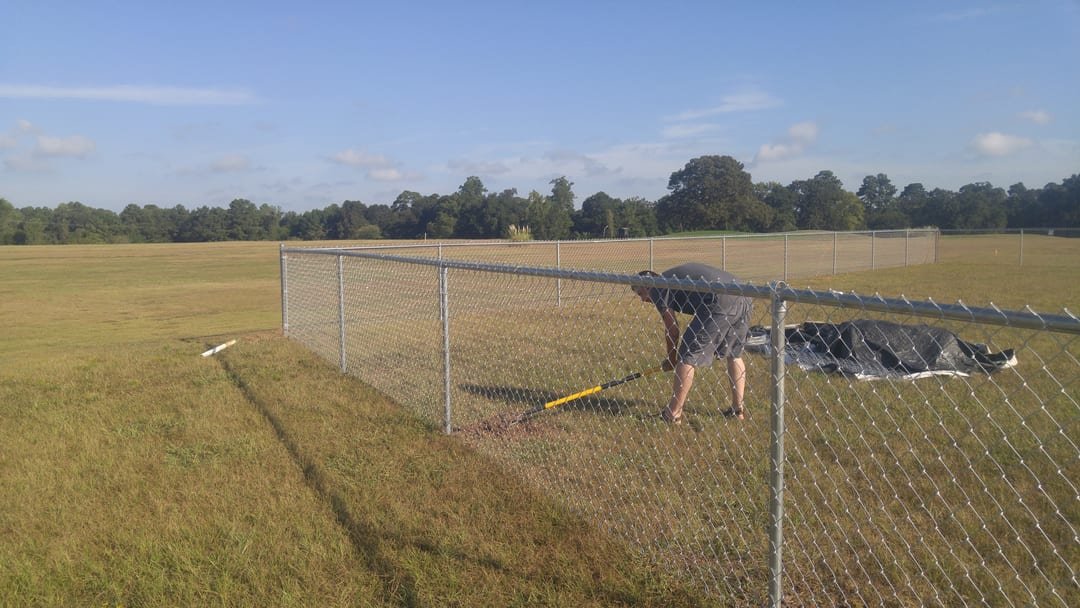 Galvanized chain link fence around a commercial lot