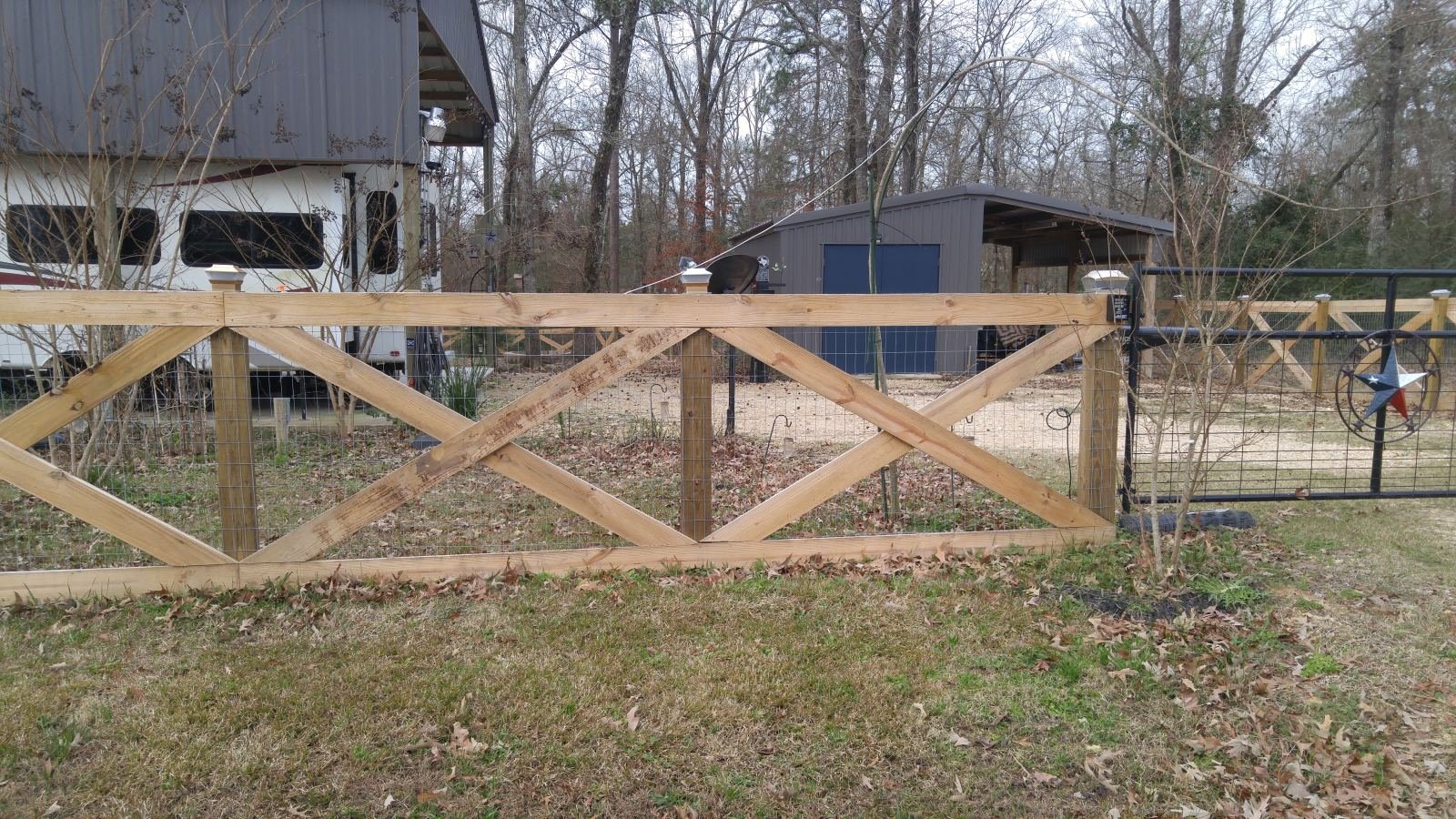 Aerial view of a cross-buck fence around a rural property