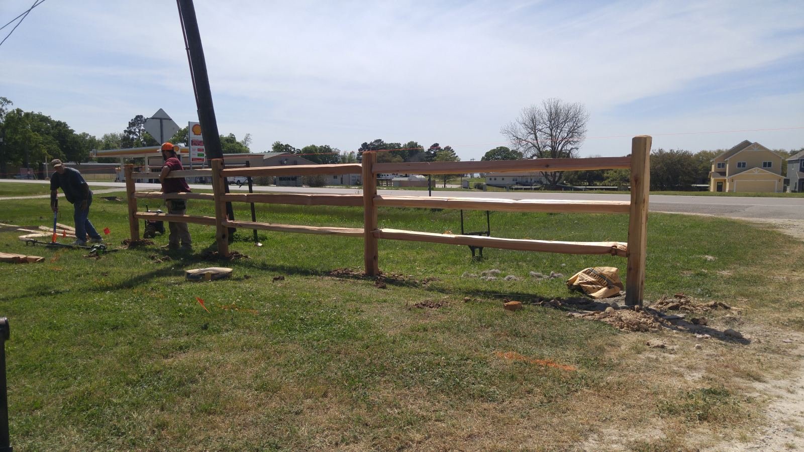 Cedar split-rail fence along a road frontage