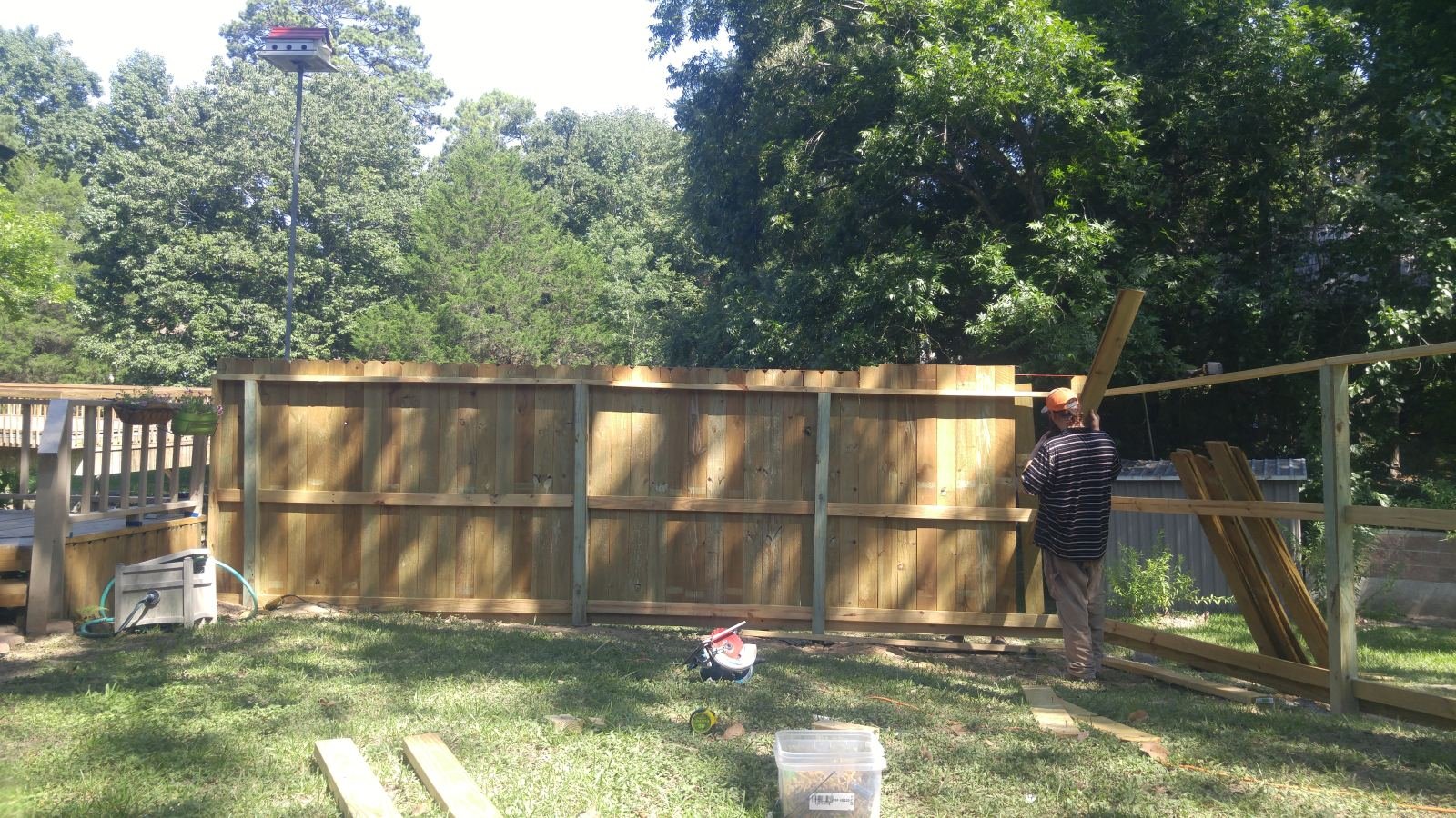 Wood privacy fence under construction
