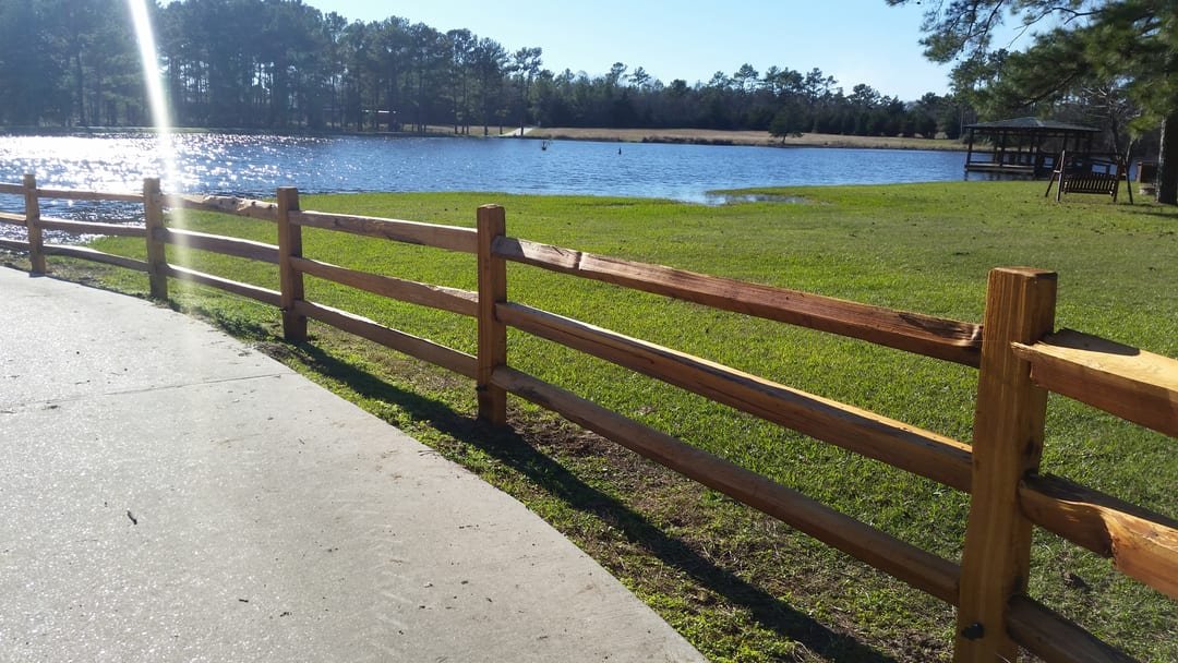 Cedar split rail fence at a lakeside park