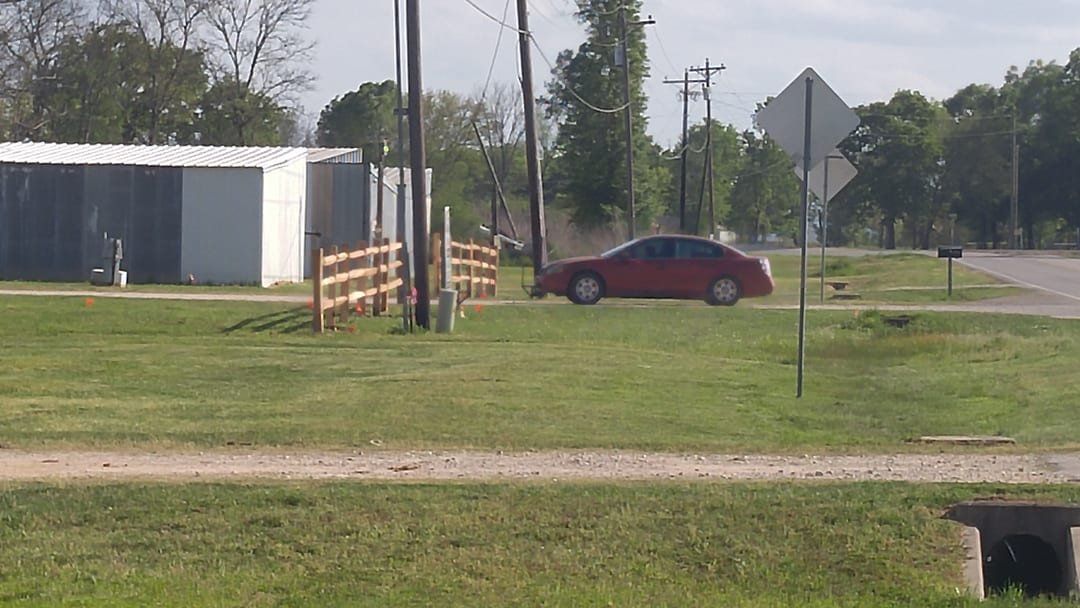 Cedar split rail fence at a storage facility entrance