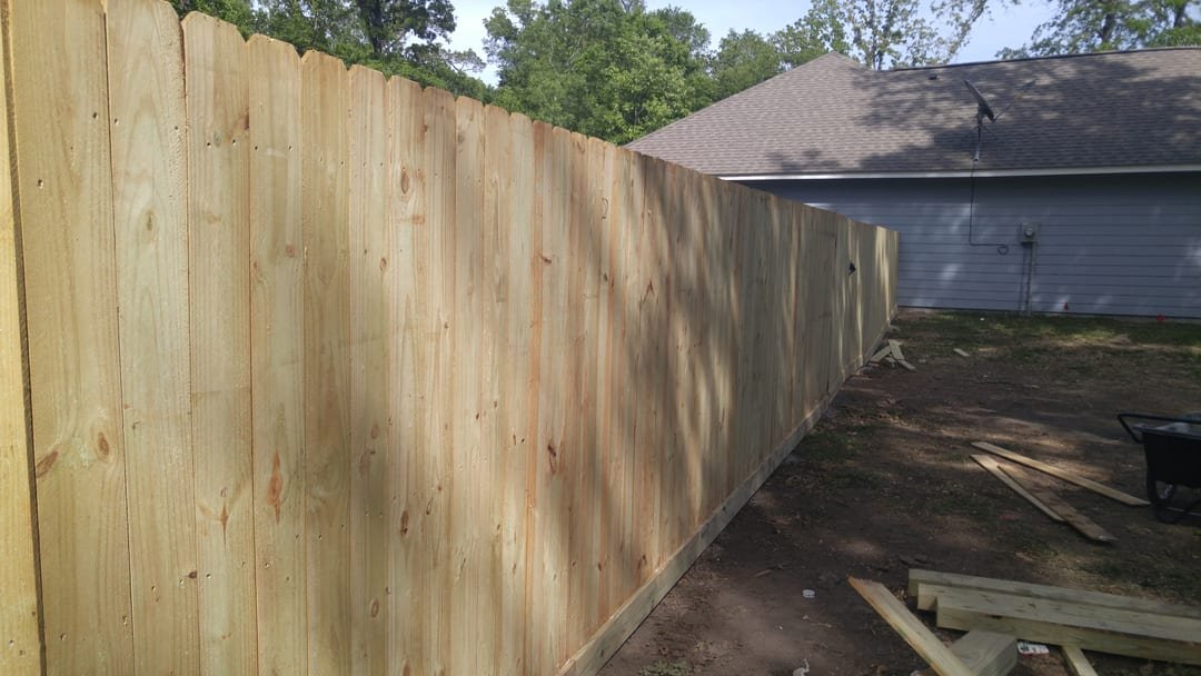 Cedar privacy fence with a clear base